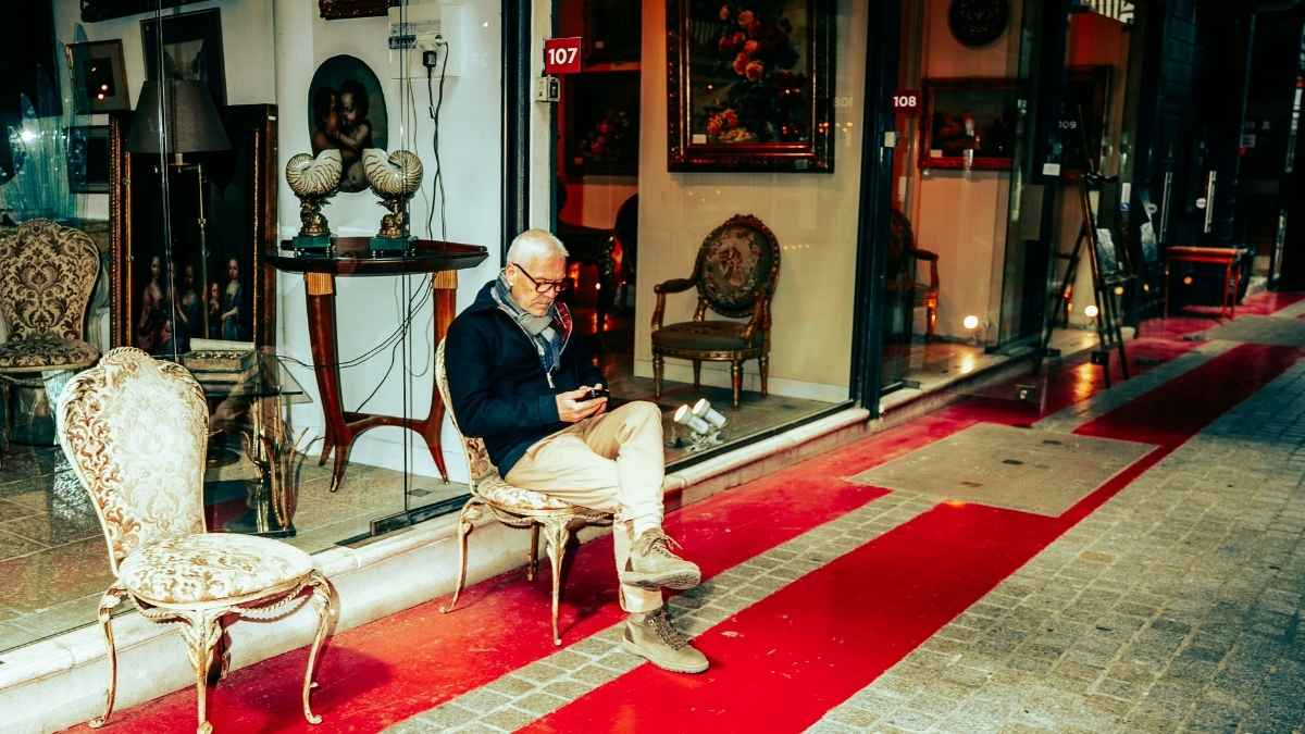 hopper browsing a rack of vintage chairs and tables at a local thrift shop